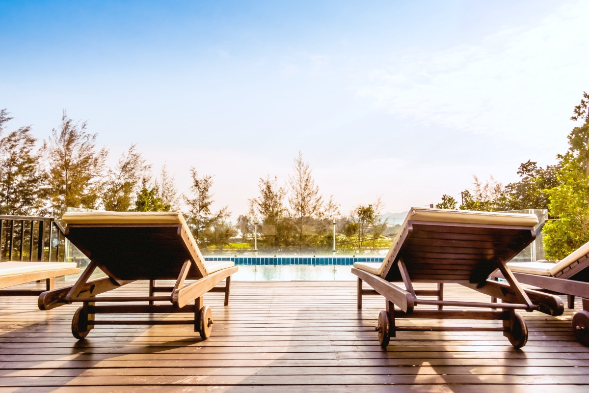 empty chair and swimming pool at hotel resort vintage filter
